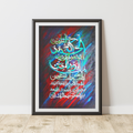 Framed artwork with colorful calligraphy on a white wall.